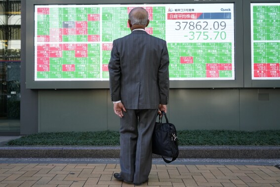 Stock market today: Asian shares slide after slight gains on Wall Street