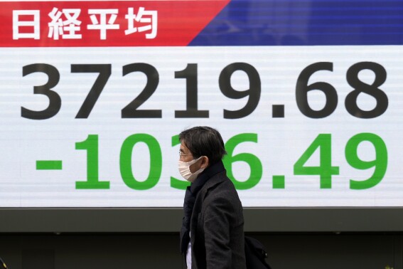 Stock market today: Asian shares skid, hit by AI doubts and Trump tariff hikes