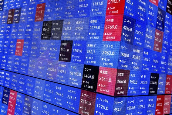 Asian shares are mixed after Wall Street briefly dips more than 10% below its record