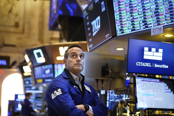 Stock market today: Asian shares are mixed after Wall St edges lower on US policy uncertainty