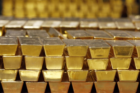 Gold rises to another record as anxiety grips markets. Here’s what you need to know