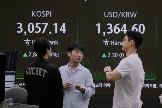 Asian shares are mostly down as Trump’s tariff deadline looms and pressure steps up